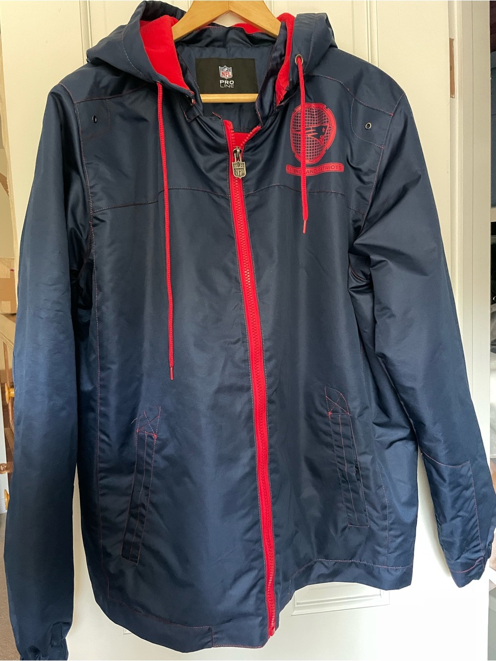 NFL New England Patriots navy blue zip up jacket size L.